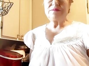 Mature woman in sheer granny nightgown, natural tits