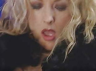 Danni Ashe strokes herself with feathers