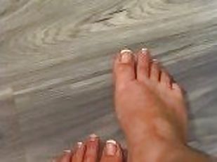 Latina needs help rubbing oil on her feet!