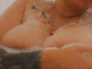 Playing with my soapy tits while in the shower