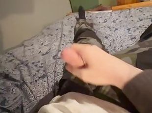 Horny boy in camo trousers jacks off and cums over himself