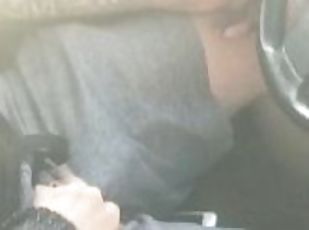 Rubbing his cock in the car