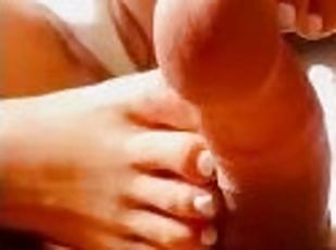 Teen Latina loves giving footjob with cumshot