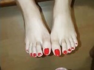 Red nail covered with sperm