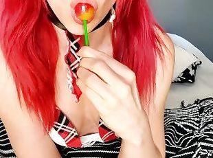 Redhead Schoolgirl Enjoying a Lollipop