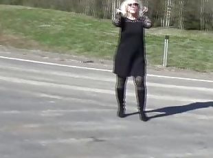 Business lady flashing on the road