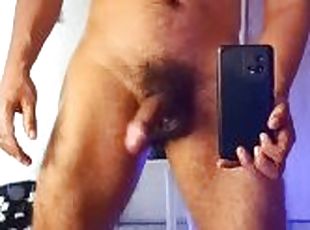 Naked muscular guy masturbating in front of the mirror