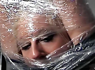 Cute girl bound in plastic wrap