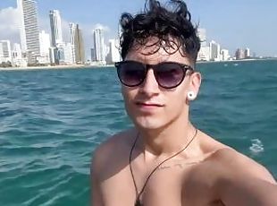 tourist exhibits himself in a boat in the sea on the Beaches of Cartagena