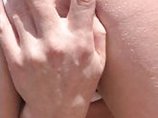 Sexy trans girl using glass dildo deep in her ass at the beach